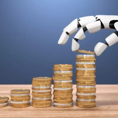 Robotarm pakt geld van tafel