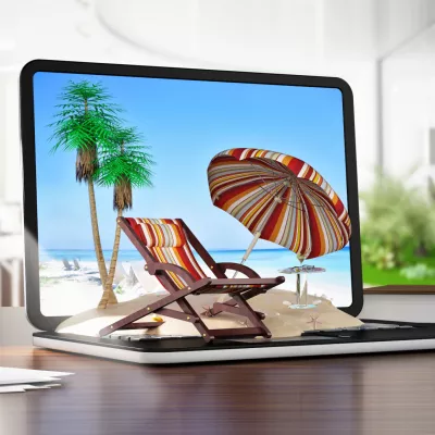 Laptop met vakantie afbeelding op het strand
