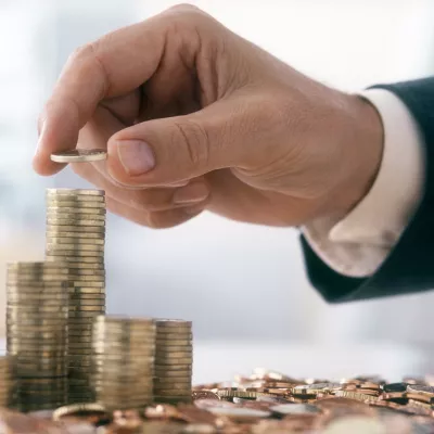Hand stacking coins