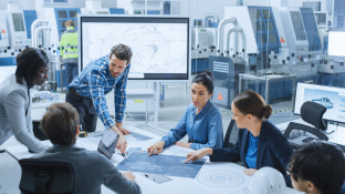 Engineers collaborating in a modern factory setting